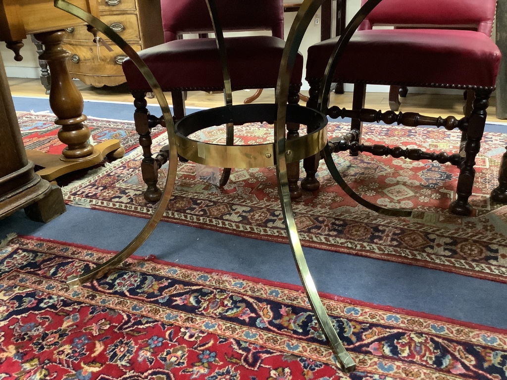 A modern circular dining table, with faux marble top on gilt metal base with splayed legs, diameter 134cm height 72cm
